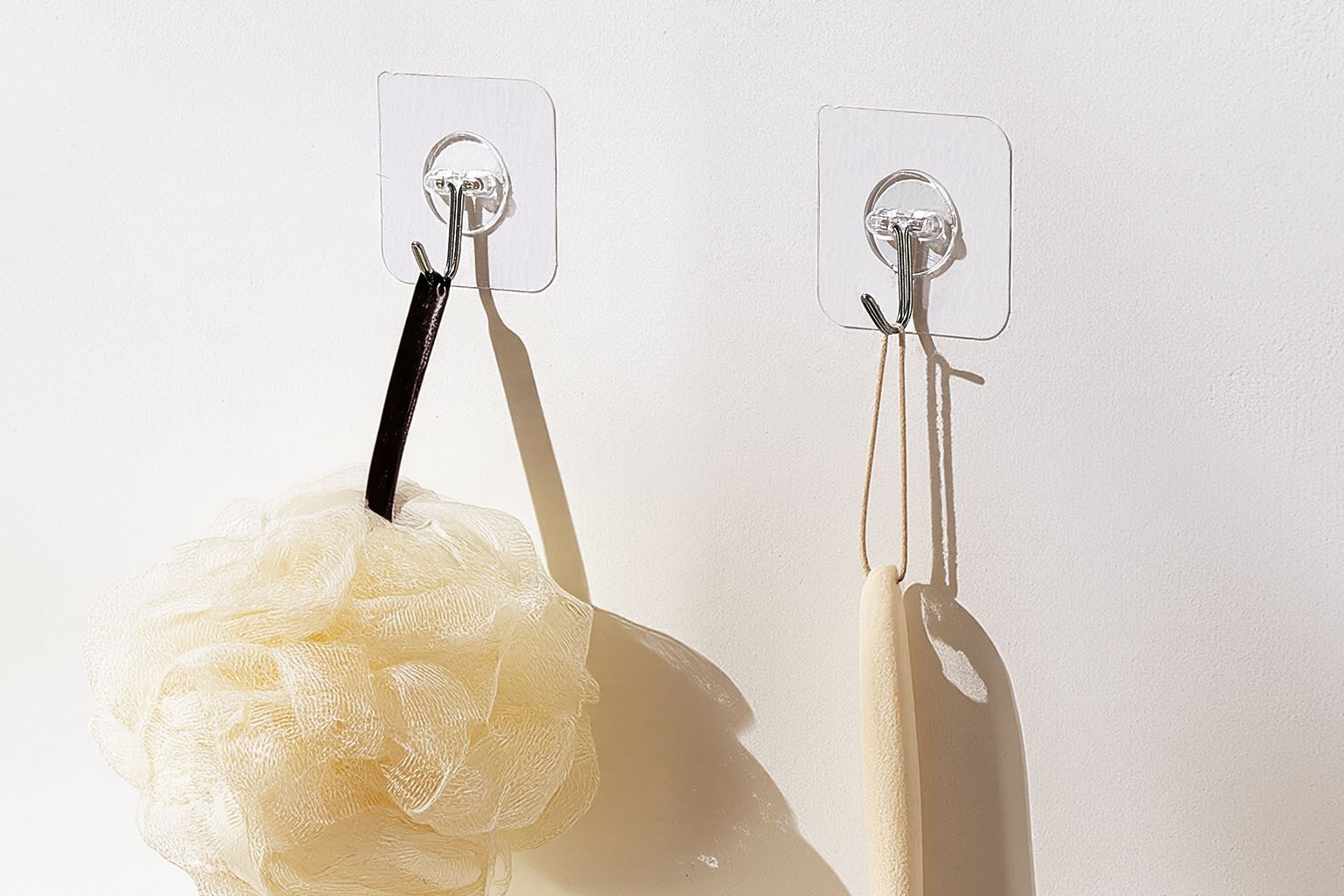 Wall hooks and rails holding everyday items in a small room